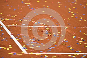 Confetti on a tennis clay court