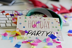 Confetti and text holiday party in an office