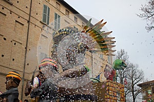 Confetti thrown in front of the carnival allegorical wagon.