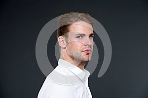 Confidence and masculinity. Guy confident in his appearance. Man well groomed with bristle and hairstyle dark background