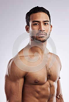 Confidence, shirtless and portrait of a man in a studio after a workout or body strength training. Serious, sports and