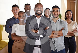 Confidence and success go hand in hand. Cropped portrait of a diverse group of businesspeople standing with their arms