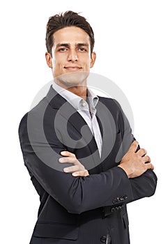 Confidence in a suit. Portrait of a confident young man standing with his arms crossed.