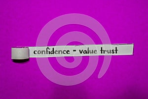 Confidence - Value Trust, Inspiration, Motivation and business concept on purple torn paper