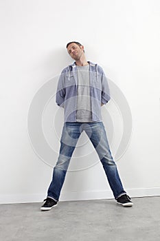 Confident 40s man standing on legs for reflection or arrogance