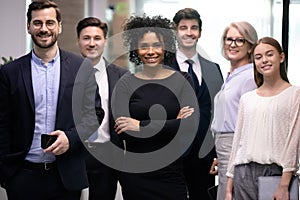 Confident african american business woman boss with happy businesspeople team