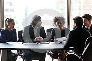 Confident African American hr manager asking questions to candidate