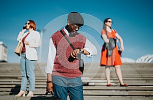 Business professionals in casual wear checking time outdoors photo