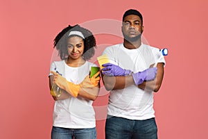 Confident African Couple With Cleaning Tools In Hands Posing With Folded Arms