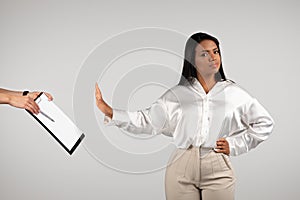 Confident angry young african american business woman making stop gesture with hand for contract