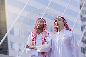 Confident Arabian Businessman standing and looking at city background for vision concept