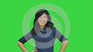 Confident asian businesswoman tearing the paper into small pieces and throwing it on a Green Screen, Chroma Key
