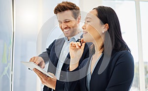 Confident asian businesswoman thinking of ideas with her hand on her chin while planning a project with a caucasian