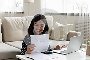 Confident asian female prepare to pay bill using computer app