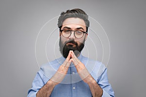 Confident man with stacked hands