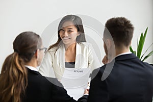 Confident beautiful millennial asian applicant smiling at job in