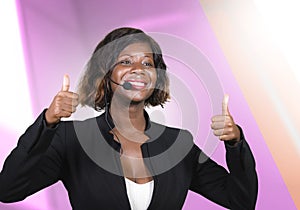 Confident black afro American business woman with microphone speaking in auditorium at corporate seminar event giving success