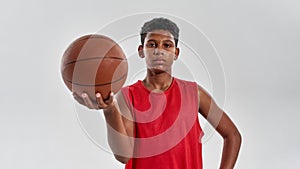 Confident black boy basketball player with ball