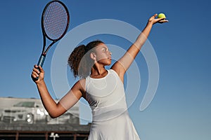 Confident black tennis player with racket and ball