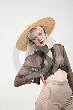 Confident Blonde in Straw Hat Posing