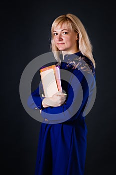 Confident blonde woman with documents in her hands