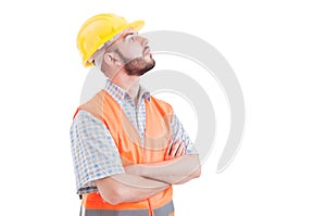 Confident builder or engineer looking up right