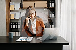 Confident business expert attractive smiling young woman holding digital tablet on desk in creative office