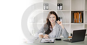 Confident business expert attractive smiling young woman holding digital tablet on desk in office