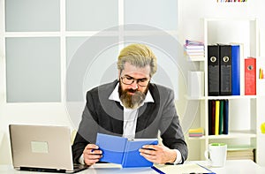 Confident business expert. lawyer use notebook for work. bearded man sit at desk in office. confident brutal businessman