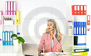 Confident business expert. modern life. woman in a busy modern workplace. communicating on digital device at home