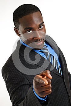 Confident business man pointing