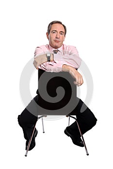 Confident business man sitting on a chair