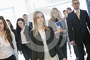 Confident business people at convention center