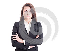 Confident business woman with arms crossed on white copy space