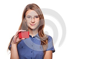 Confident business woman in glasses showing blank credit card