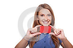 Confident business woman in glasses showing blank credit card