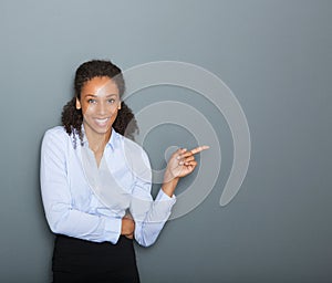 Confident business woman pointing finger