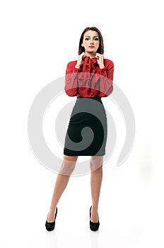 Confident business woman pulling on her collar