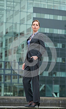 Confident business woman standing outdoors