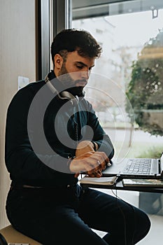 Confident businessman discussing innovative strategies for business growth during a private phone call in a soundproof