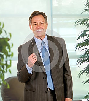 Confident Businessman In Executive Office