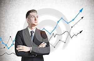 Confident businessman and growing graph