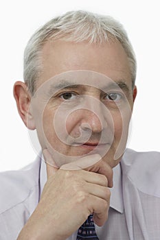 Confident Businessman With Hand On Chin