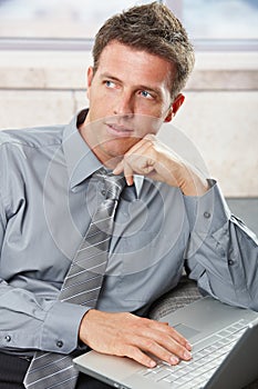 Confident businessman looking aside photo