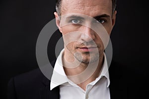 Confident businessman looking at camera