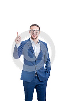 Confident businessman pointing up forefinger smiling isolated on white background. Contented business person, wearing eyeglasses,