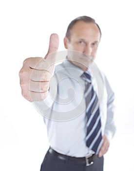 Confident businessman shows his thumb up.isolated on white