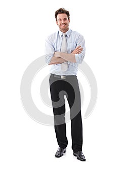 Confident businessman smiling arms crossed