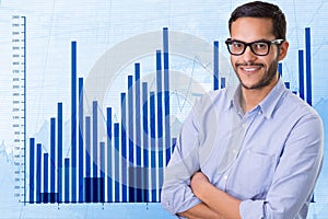 Confident businessman standing arms crossed against graph