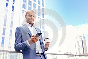 Confident businessman standing near office